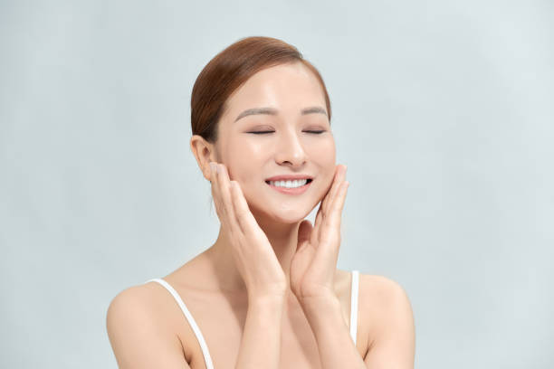 istock close up young smiling beauty face 1303801838