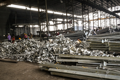 Raipur, India - July 3rd, 2020: People working in a steel factory in India.