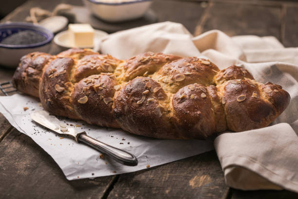 istock Tsoureki braid, greek easter sweet bread, on wood 1303804373