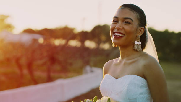 istock Just a blissful bride and a beautiful sunset 1303804596