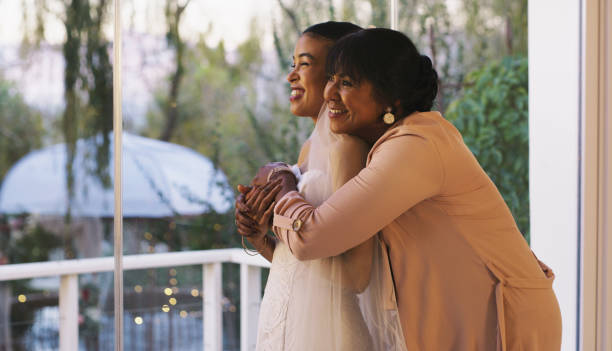 I am so proud of you Cropped shot of a happy young bride bonding with her mother while she gets ready for her wedding bride hugging father on wedding day stock pictures, royalty-free photos & images