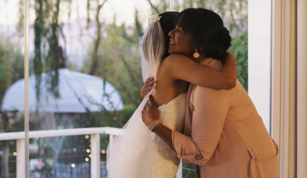 Words are not enough to express unconditional love Cropped shot of a happy young bride hugging her mother before walking down the isle for her wedding bride hugging father on wedding day stock pictures, royalty-free photos & images