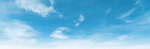 istock Summer Blue Sky and white clouds background. Beautiful clear cloudy in sunlight spring season. Panorama vivid cyan cloudscape in nature environment. Outdoor horizon skyline with spring sunshine. 1303804684