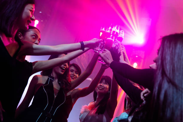 istock Young people celebrating a party, drink and dance 1303804720