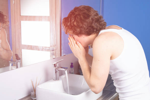 istock Handsome young man in the bathroom. 1303805766