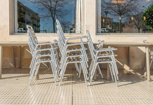 istock Metal chairs and tables stacked outdoor 1303807664