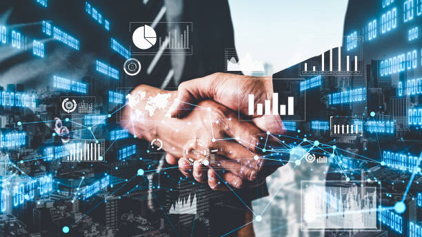 istock Imaginative visual business handshake with computer graphic of investment data 1303807972