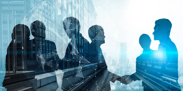 Silhouette view of business people team in group meeting Silhouette view of business people team in group meeting on city office building background showing partnership success of business deal. Concept of teamwork, trust and agreement. business people silhouette stock pictures, royalty-free photos & images