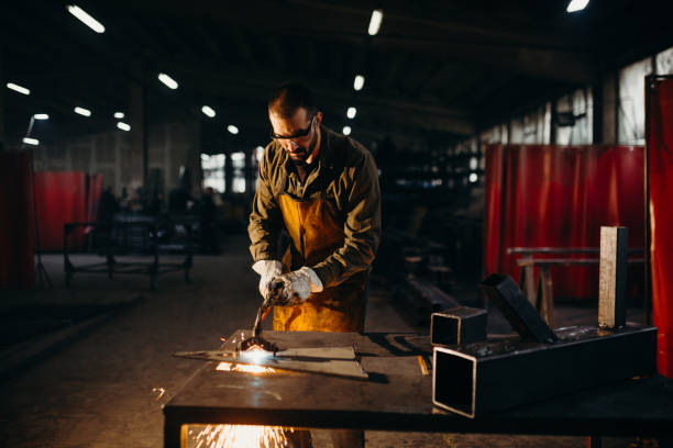istock Welder working in a factory 1303809590