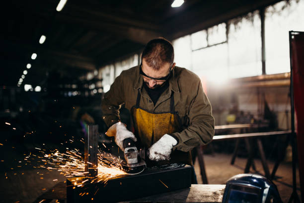istock Welder working in a factory 1303809623