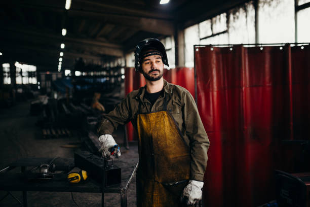 istock Welder working in a factory 1303809677