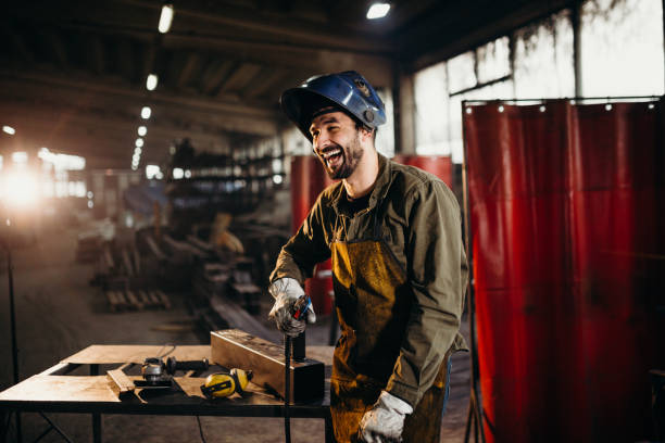 istock Welder working in a factory 1303809760