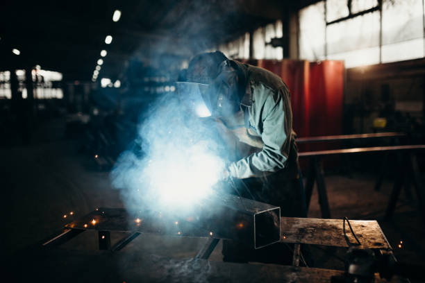 istock Welder working in a factory 1303809769