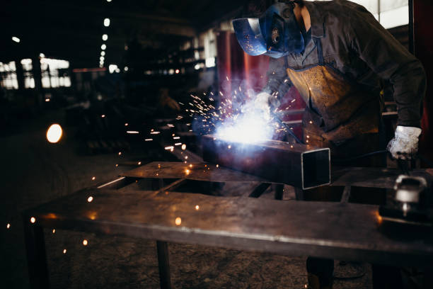istock Welder working in a factory 1303809812
