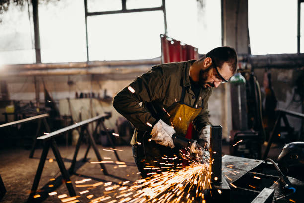 istock Welder working in a factory 1303809822
