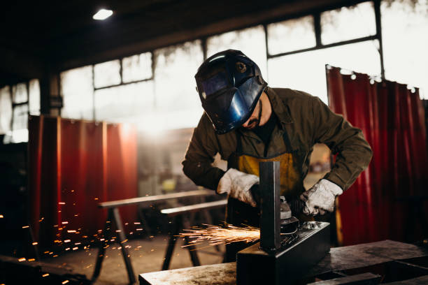 istock Welder working in a factory 1303810359