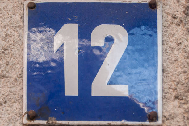 istock Weathered enamelled plate number 12 1303810362