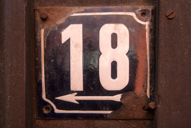 istock Weathered enamelled plate number 18 1303810365