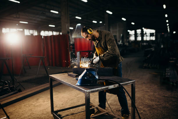 istock Welder working in a factory 1303810387
