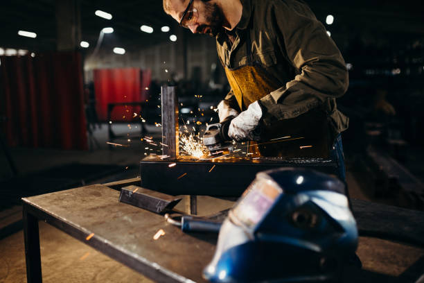 istock Welder working in a factory 1303810537