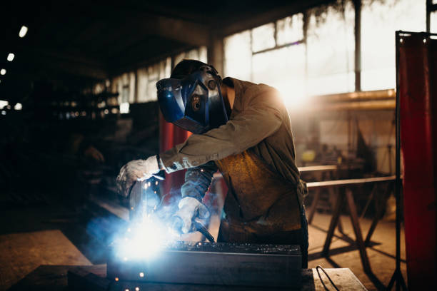 istock Welder working in a factory 1303810566