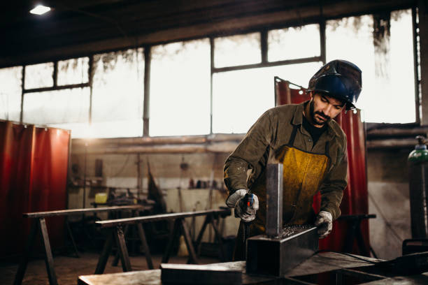 istock Welder working in a factory 1303810612
