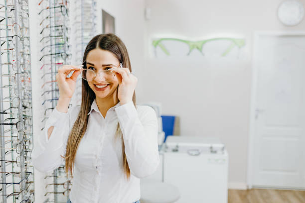 istock Female patient checking vision in ophthalmological clinic 1303811119