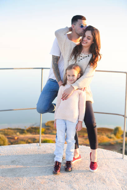 istock Young happy family in sunlight 1303811998