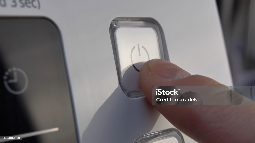 Pressing Stand By Power Button To Turn On and Off the Device Close-Up Turning On Or Off Stock Photo