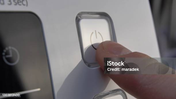 Pressing Stand By Power Button To Turn On And Off The Device Closeup Stock Photo - Download Image Now