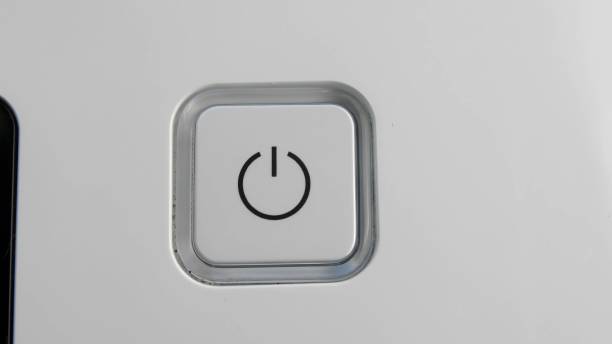istock Pressing Stand By Power Button To Turn On and Off the Device Close-Up 1303813405