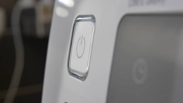 istock Pressing Stand By Power Button To Turn On and Off the Device Close-Up 1303813444