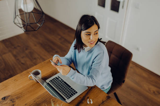 istock young woman having a video call with her friends 1303815363