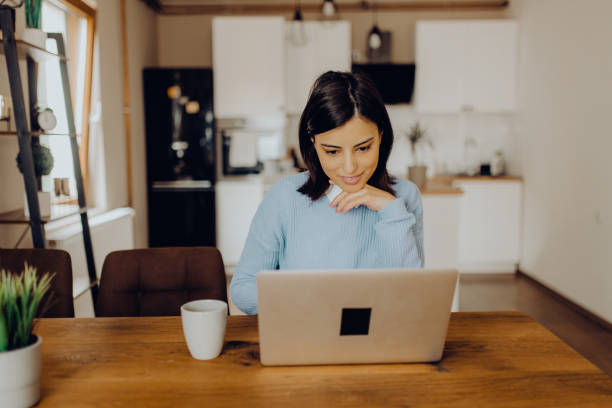 istock young woman having a video call with her friends 1303815384