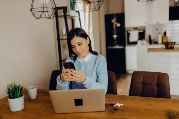 istock young woman having a video call with her friends 1303815436