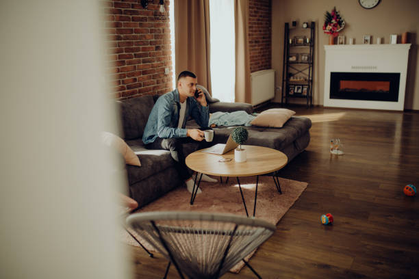 istock young father works from home while the little baby sleeps 1303820416