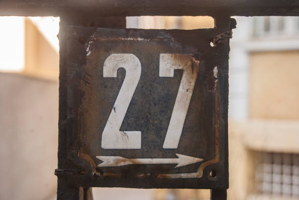 istock Weathered enamelled plate number 27 1303822154