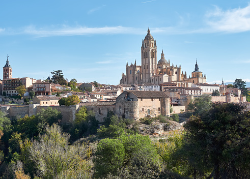 Aerial view of the city of Segovia, its wall, the Cathedral of Our Lady of the Assumption, as well as the ancient medieval architecture, all of it a World Heritage Site by UNESCO