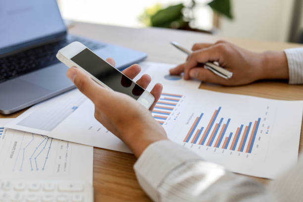 istock A man with a mobile phone And use the laptop. 1303824593