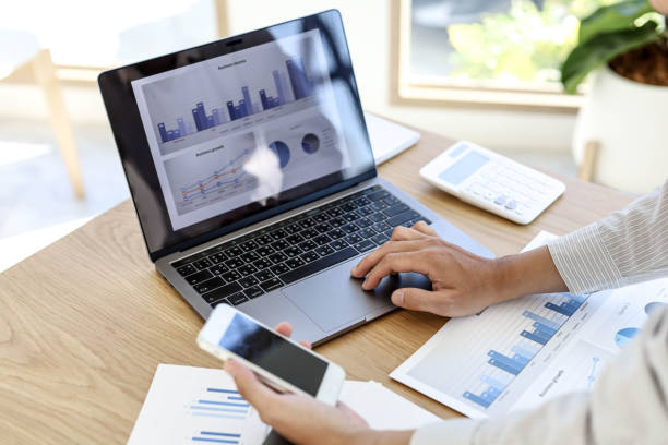 istock A man with a mobile phone And use the laptop. 1303824928