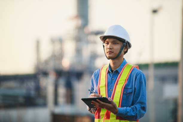 istock asian engineering working inside oil and gas refinery plant 1303825047