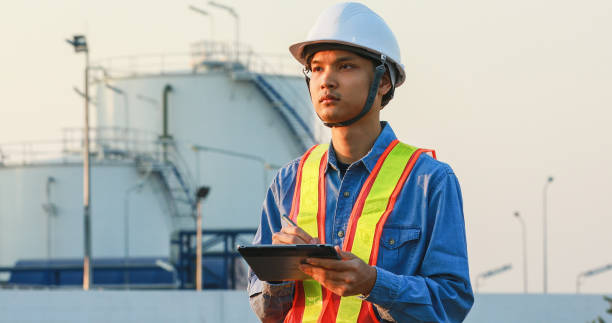 istock asian engineering working inside oil and gas refinery plant 1303825564