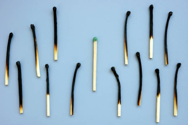 istock Burnout syndrome and assertiveness concept. New and burnt matches. 1303825600