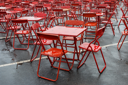 Red table and chairs after heavy rain