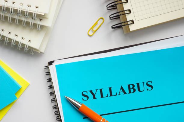 istock Syllabus educational plan and papers on the desk. 1303825740