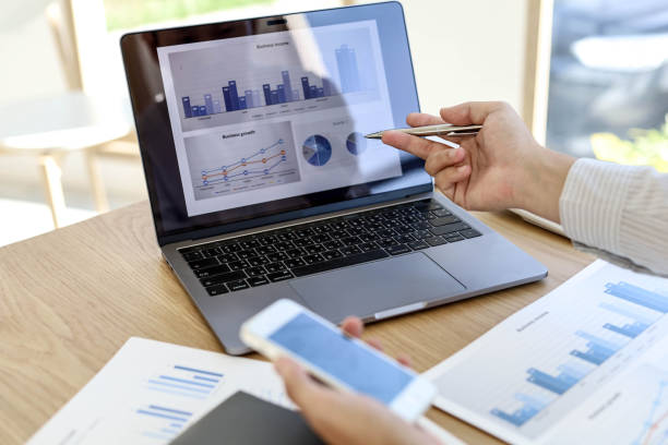 istock Management is checking laptop and mobile phone data for accuracy. 1303825755