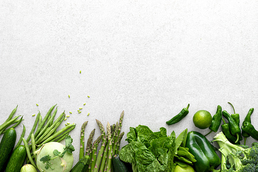 Green vegetables. Fresh green produce. Healthy vegetarian food concept background. Flat lay. Top down view