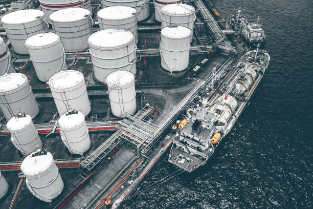 Several huge tanks for storing fuel. Several huge tanks for storing fuel. liquefied natural gas stock pictures, royalty-free photos & images
