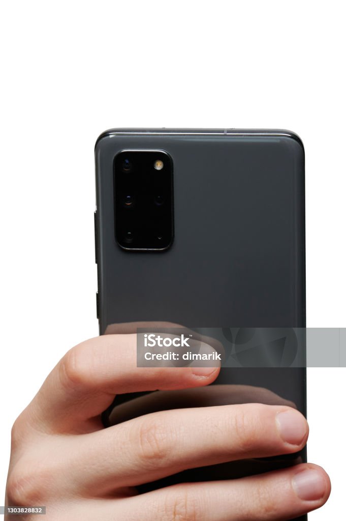 Mobile phone in hand Mobile phone in hand with triple camera isolated back view Hand Stock Photo