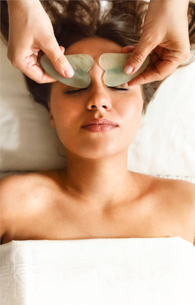 istock Face massage or beauty treatment in spa salon 1303831673